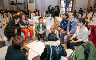 Groups of people in a workshop to prevent and respond to sexual harassment.