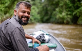 Hugo Costa on a boat in a river