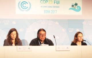 Three people speaking at COP23 on a panel
